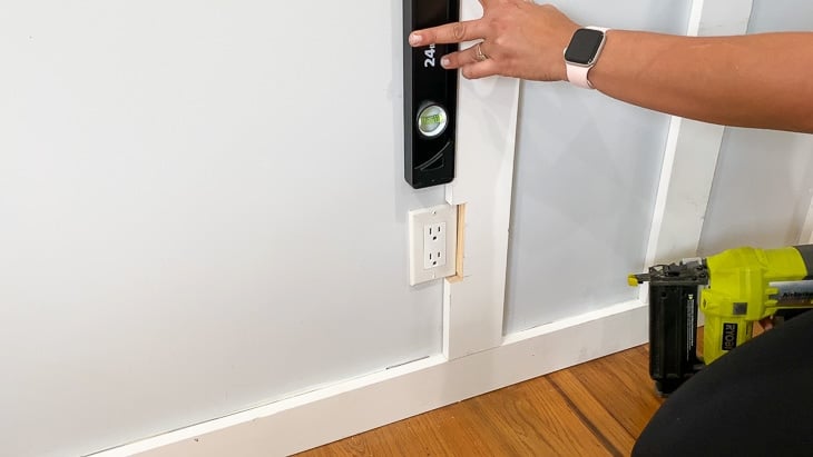 cutting out board and batten wall around the outlet