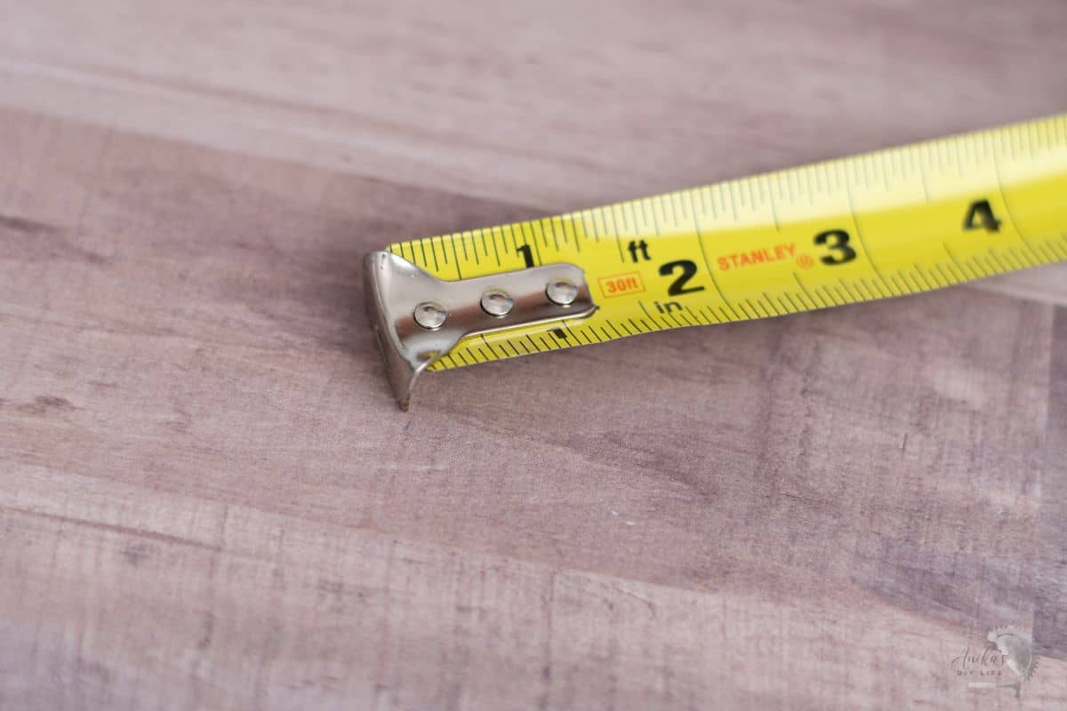 close up moving tab on a tape measure