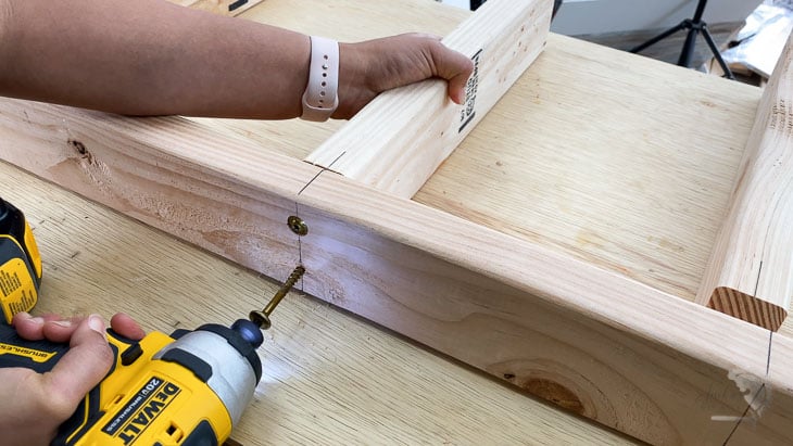 Attaching 2x4s using structural screws to make the DIY floating shelf