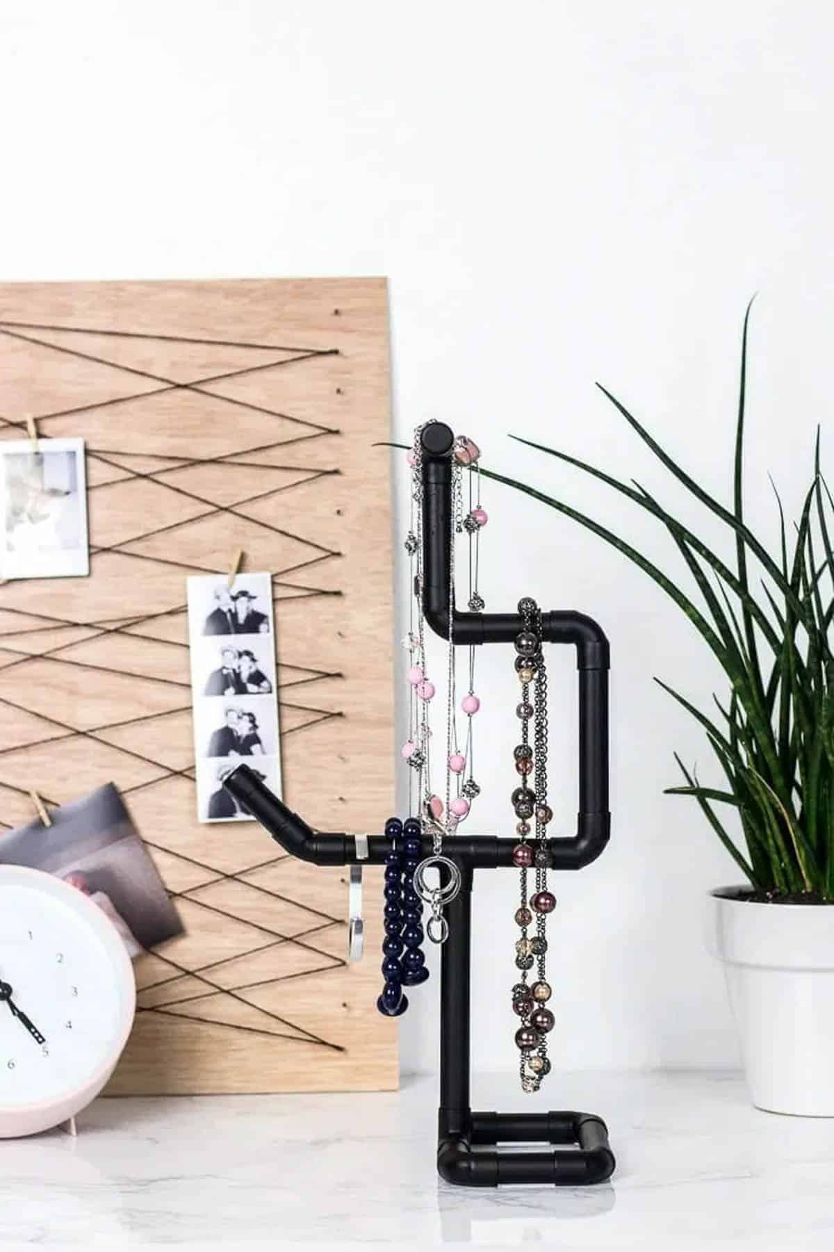 Tabletop necklace holer made from copper pipes and painted black