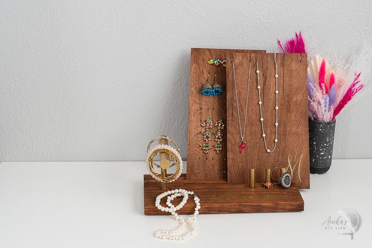 DIY Jewelry holder  with jewelry on a table