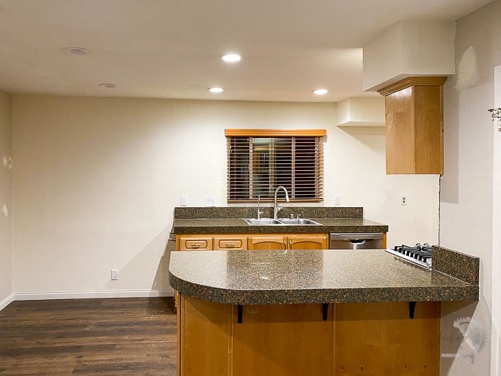 Kitchen with the window closed up and soffit removed.