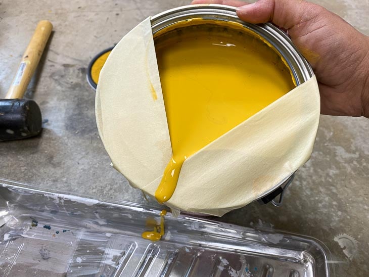 Using painter's tape to create a Pour spout on the can.