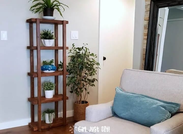 DIY plant stand made from 2x4s with five shelves