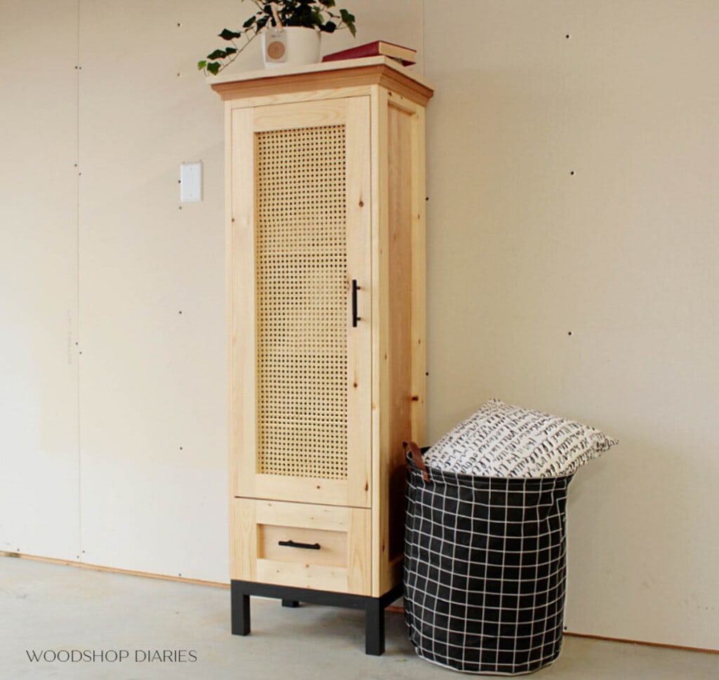 Linen cabinet with drawer and doors in cane webbing panel