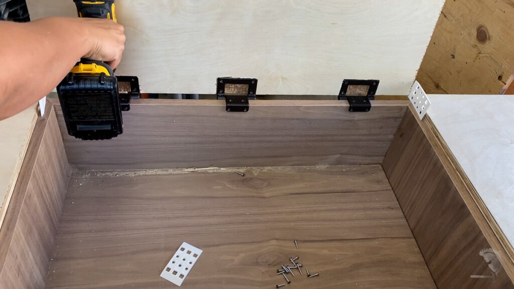 Attaching cabinet top door 