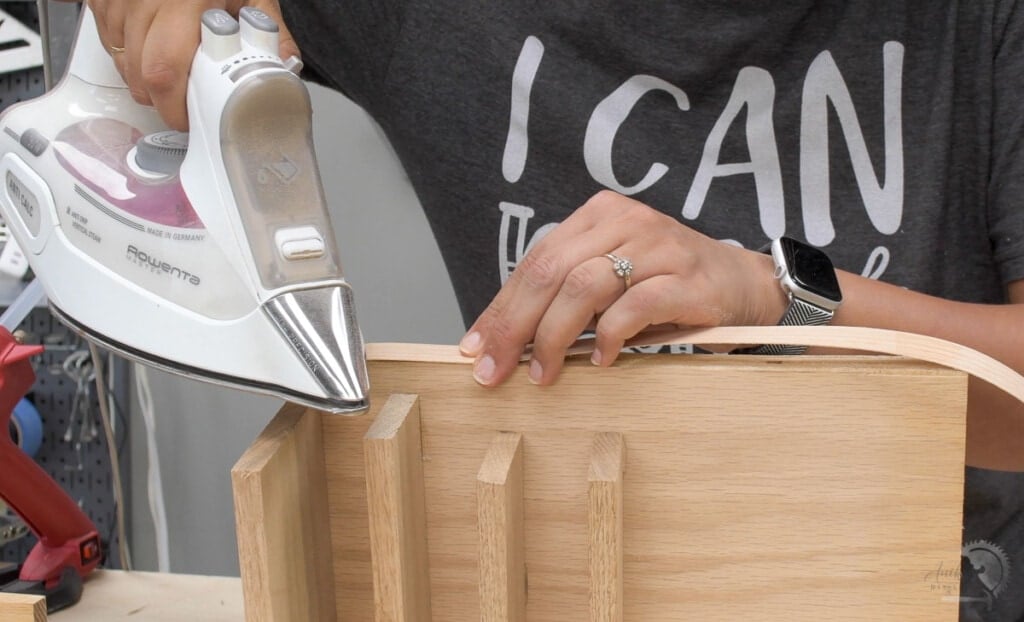 Woman applying edge banding to the plywood
