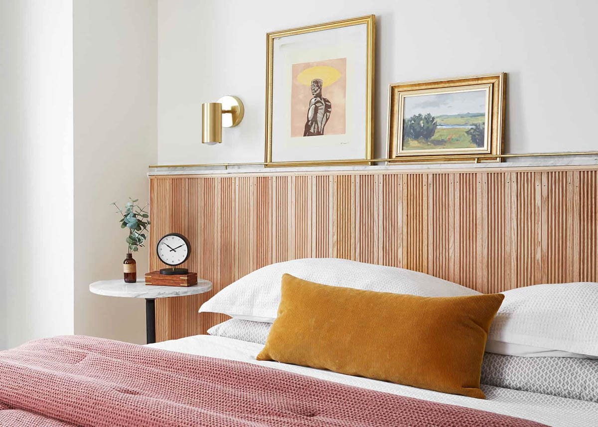 wood and marble headboard with picture ledge