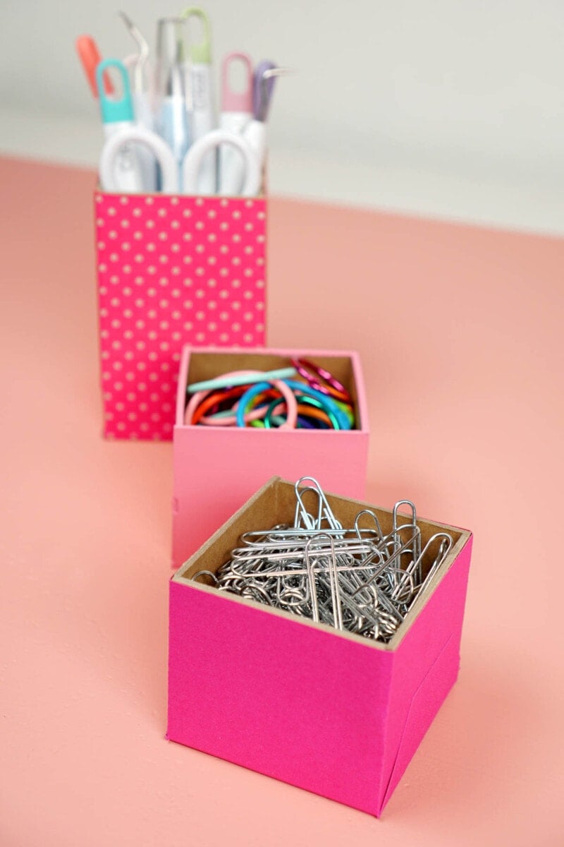 Three pink desk organizers made using chipboard