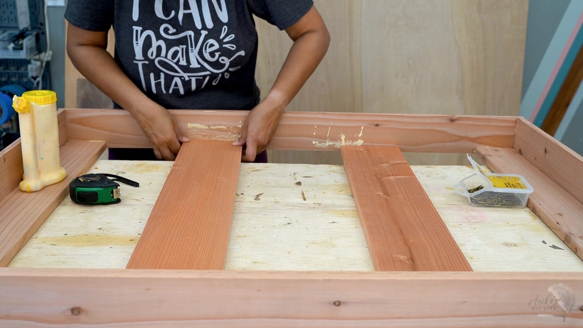 attaching the supports for the top of the potting bench