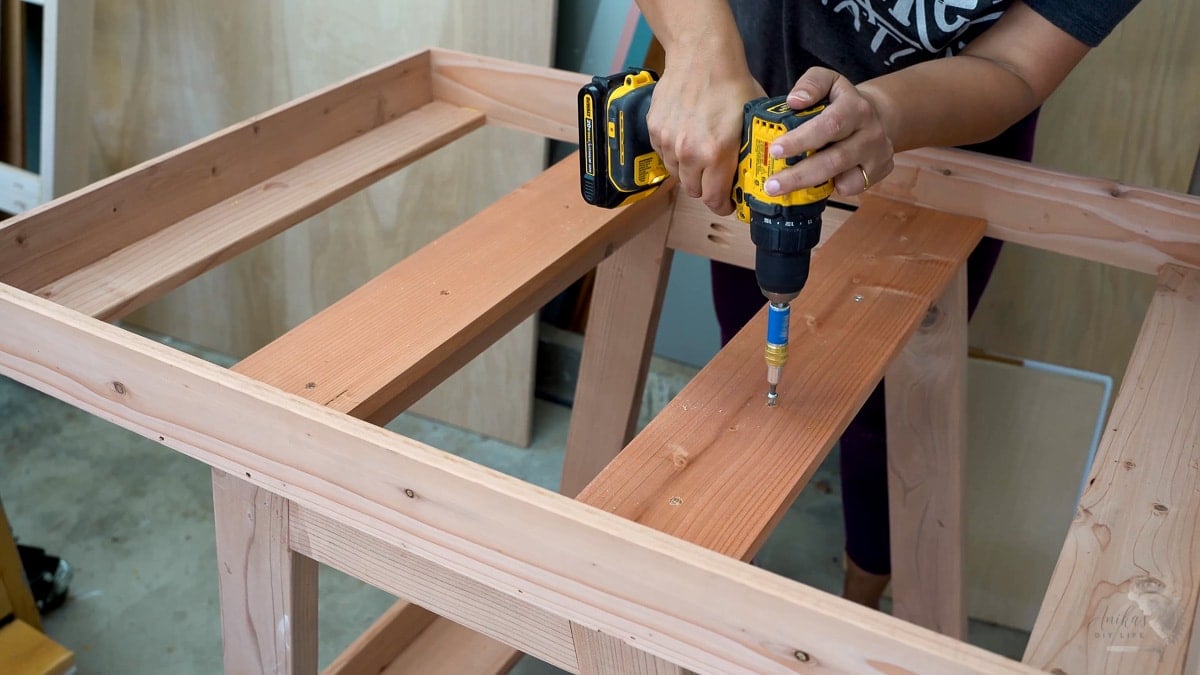 Attaching the shelf to the potting bench frame