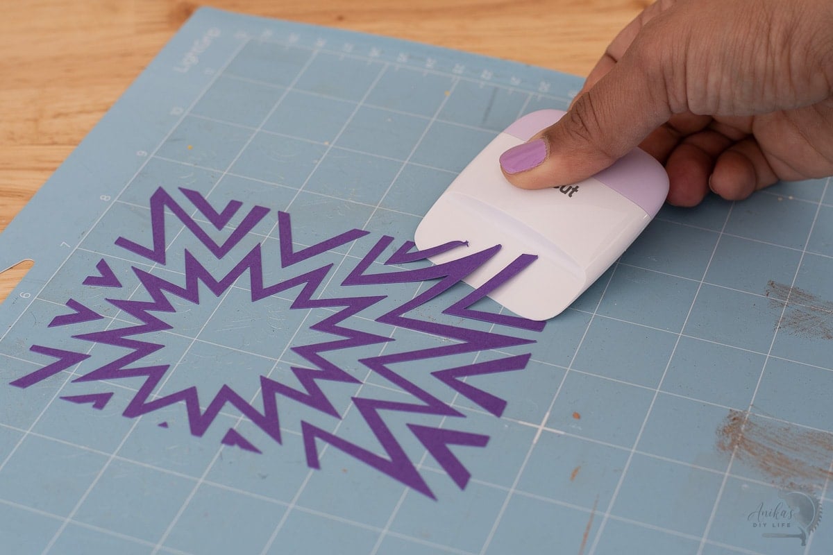Using the Cricut Scraper to remove paper from mat