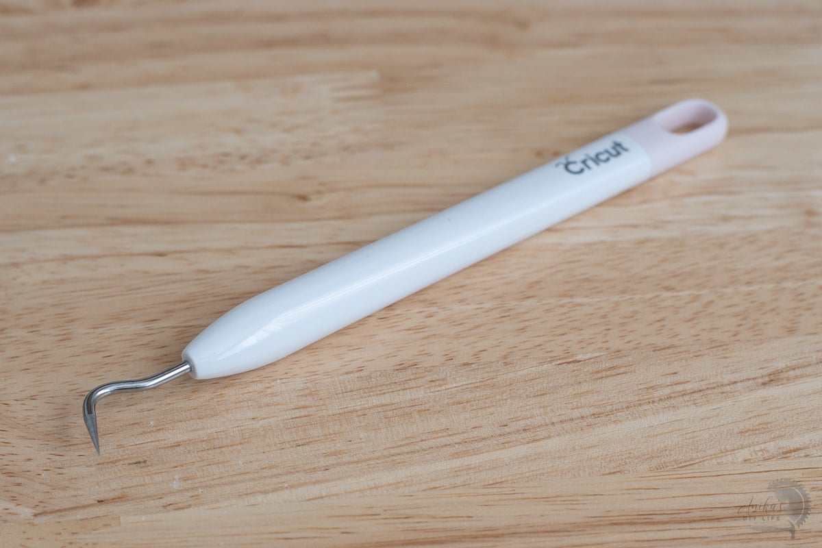 Cricut weeding tool on desk