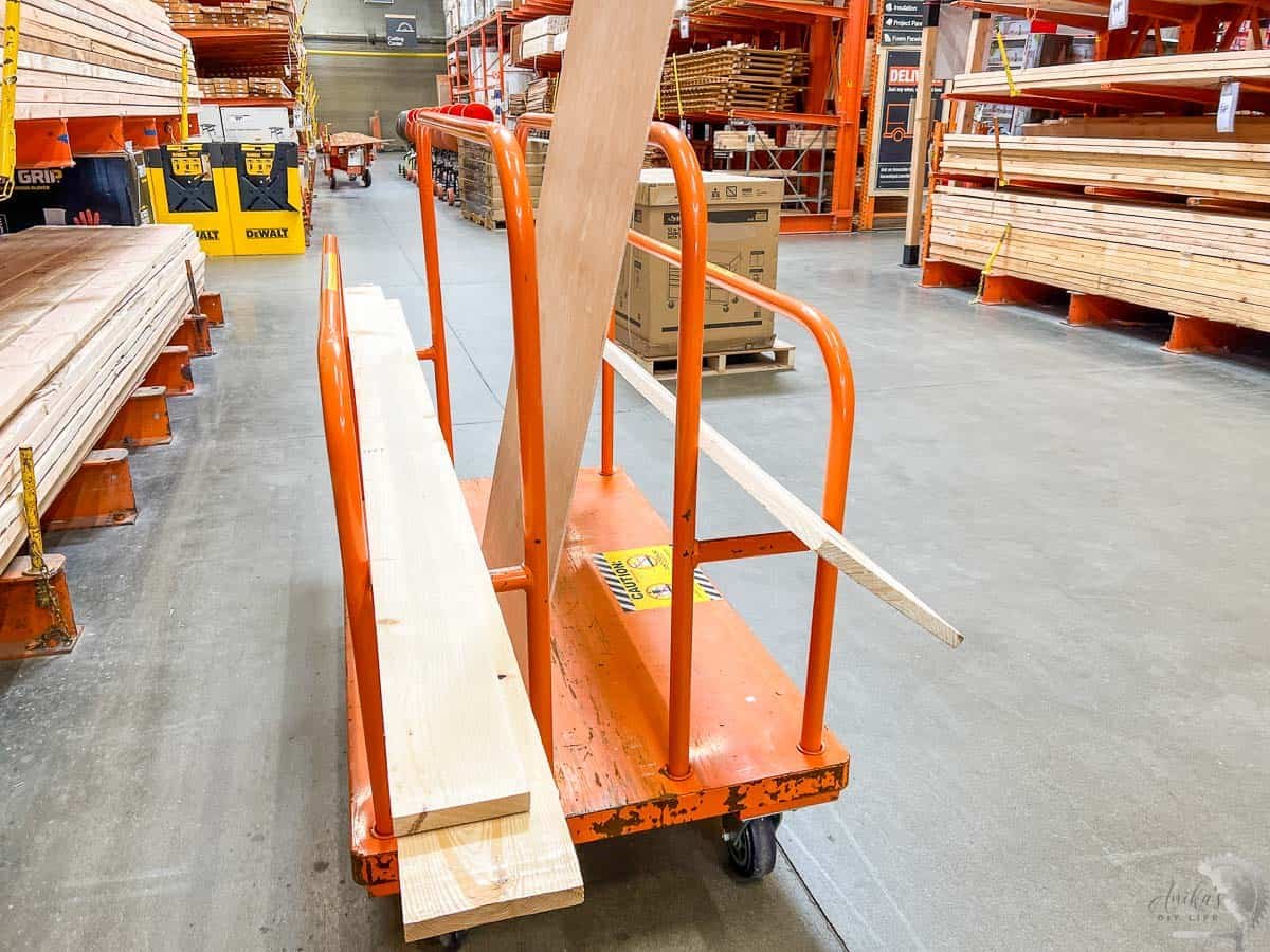 orange lumber cart in the lumber aisle. 