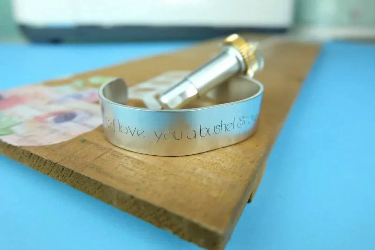 I love you a bushel and a peck engraved on metal bracelet