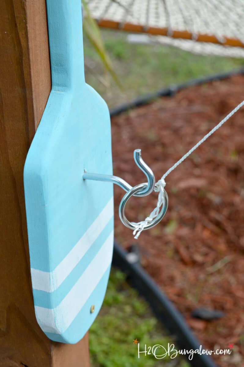 hook and ring game attache to a freestanding pole.