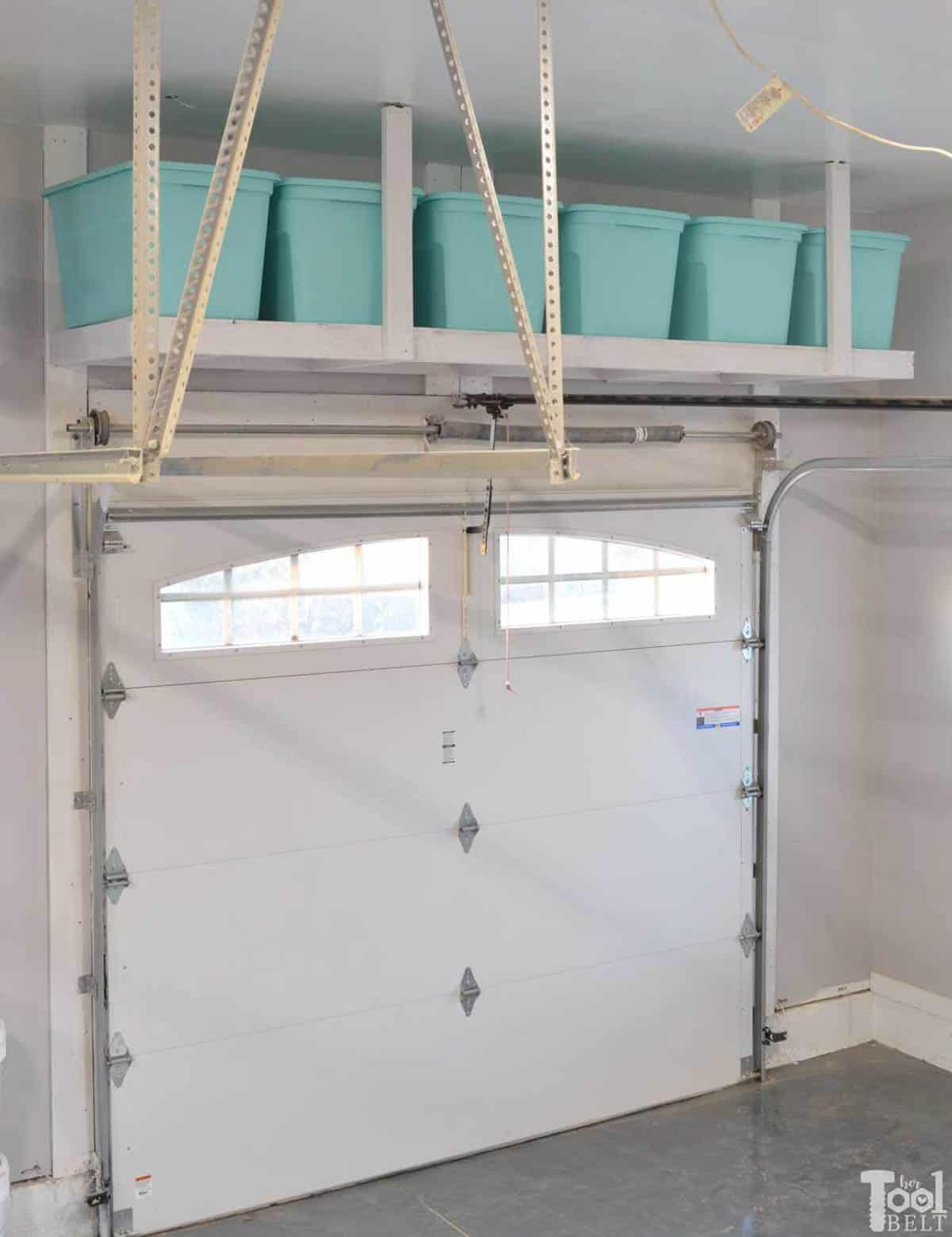 DIY overhead garage shelves over the garage door