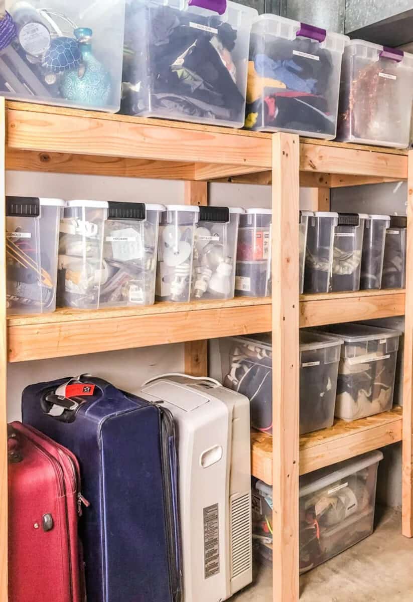 garage shelves made from wood with totes stored on them