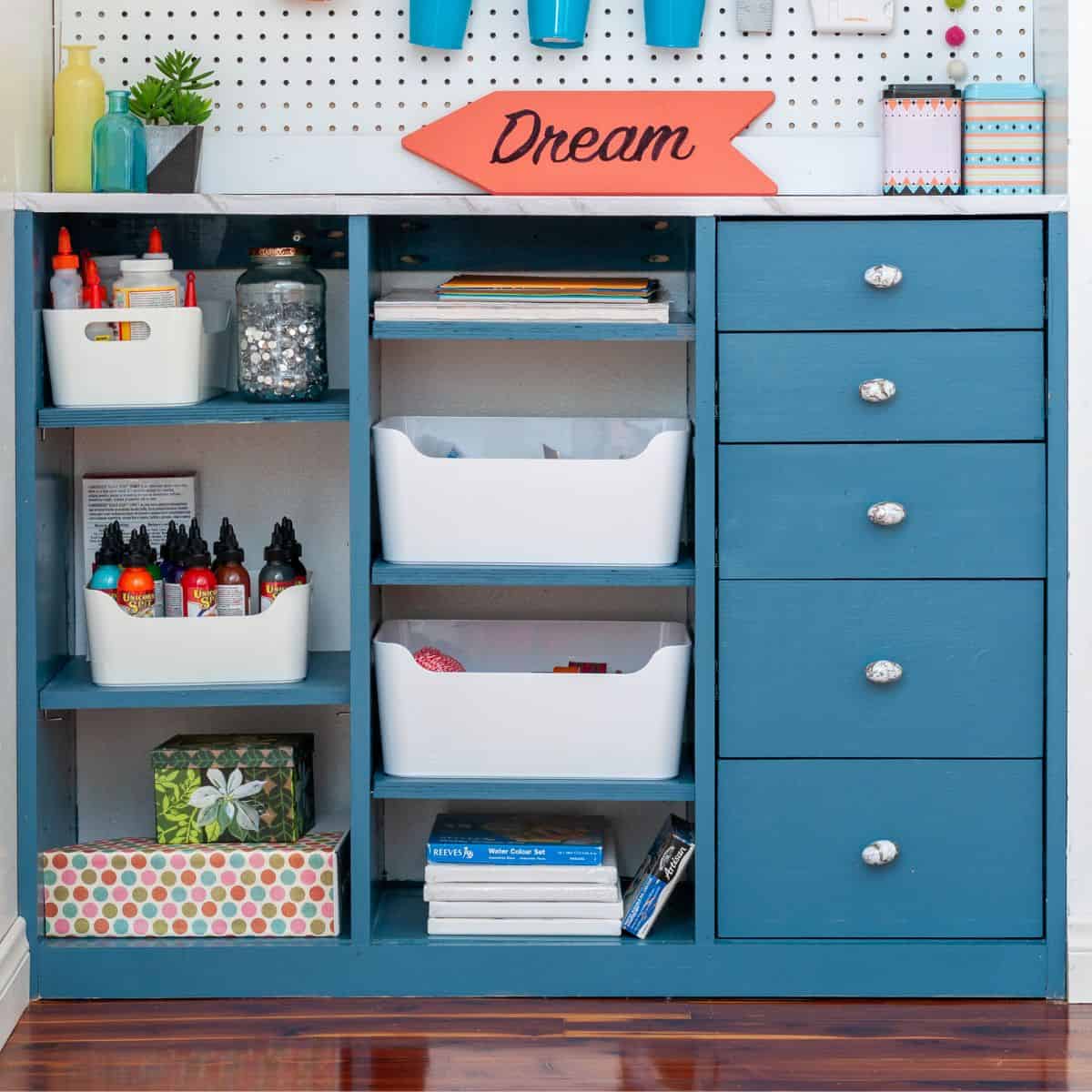 Craft closet built-in organizer with shelves and drawers