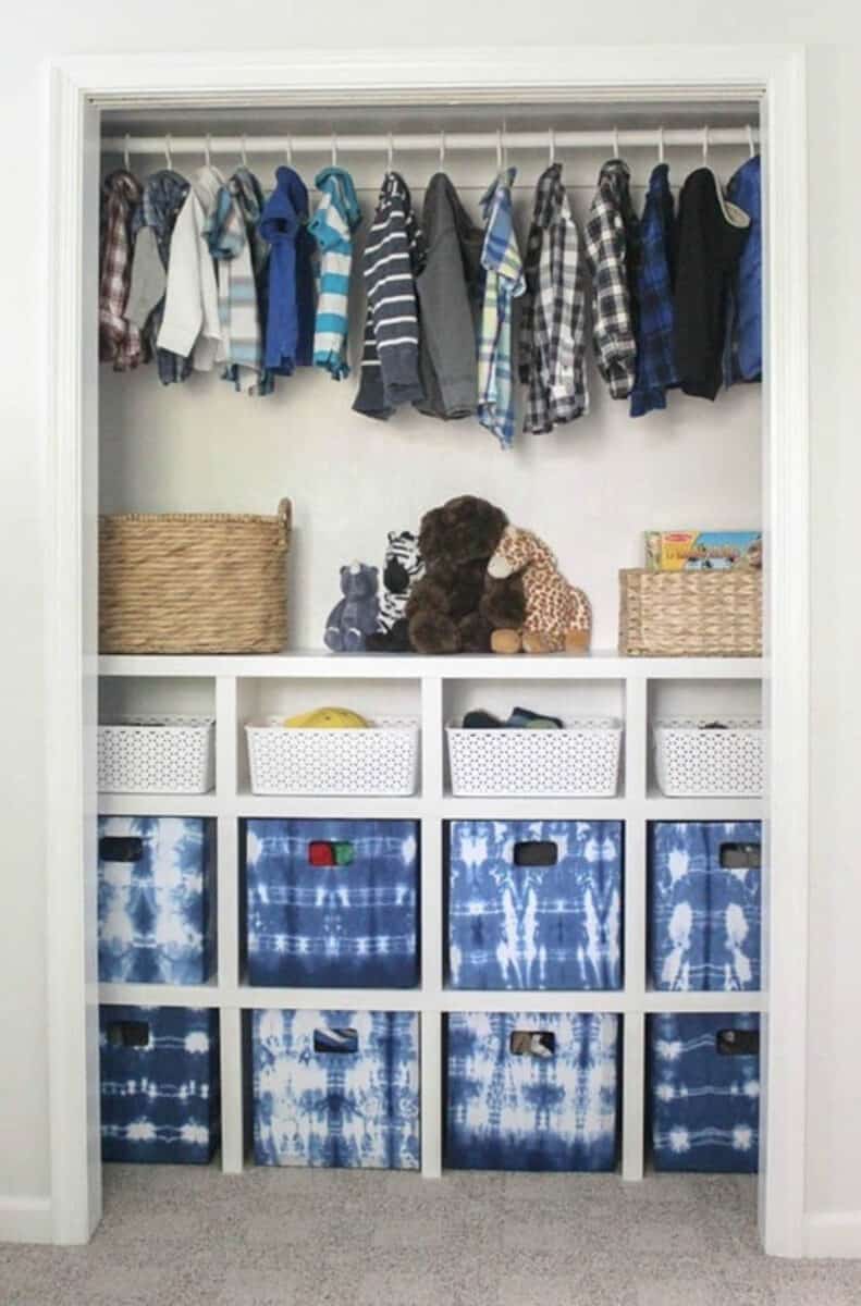 closet with shelf cubbies and hanging rod above