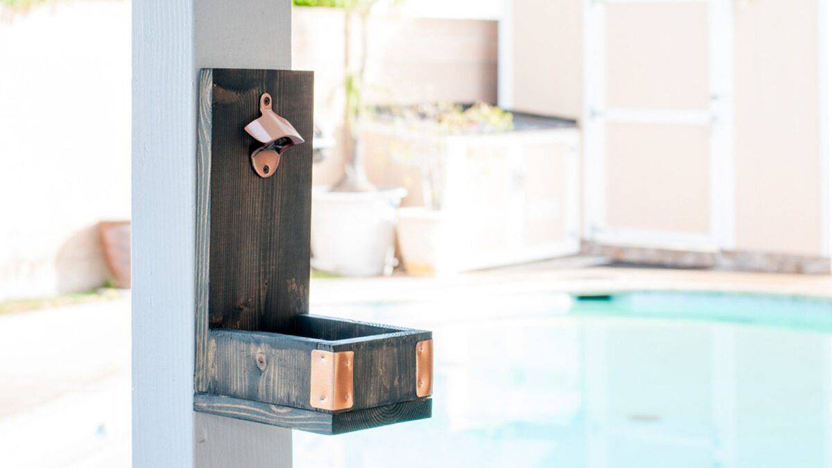 Wooden wall mounted bottle opener with brass accents