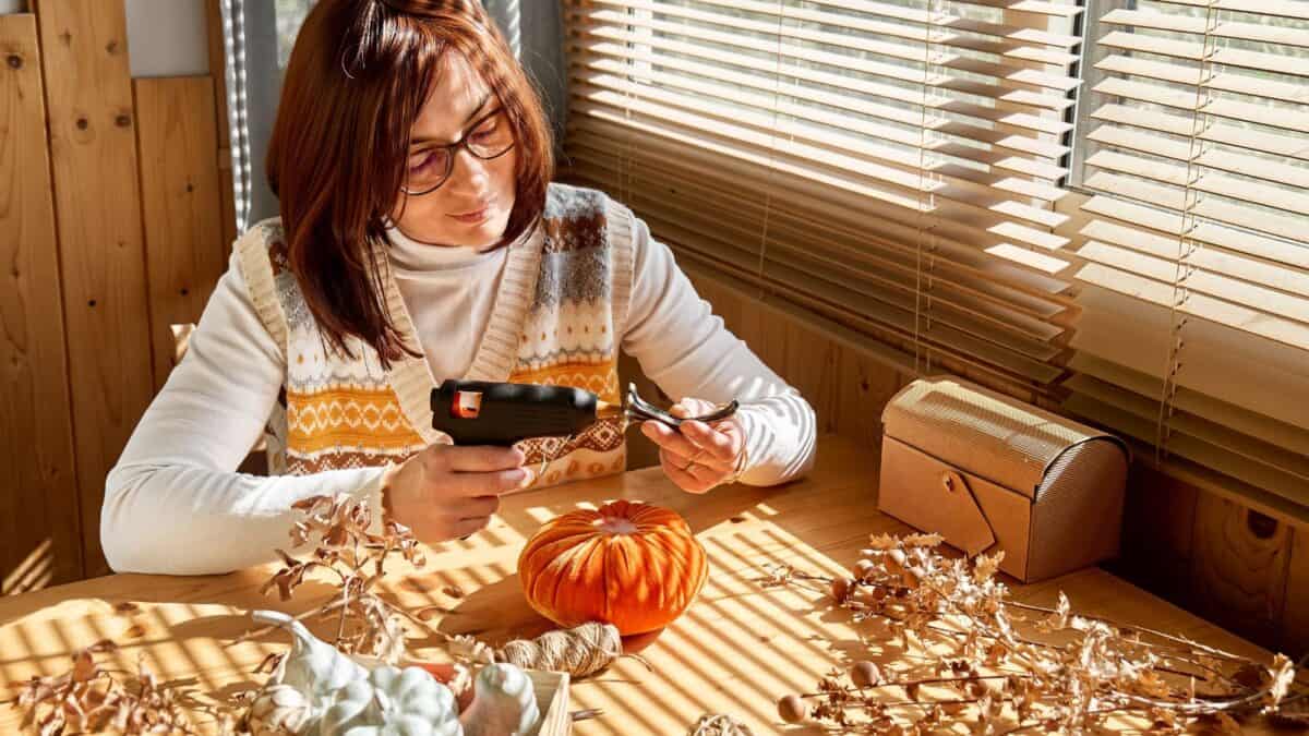 woman making DIY fall decor