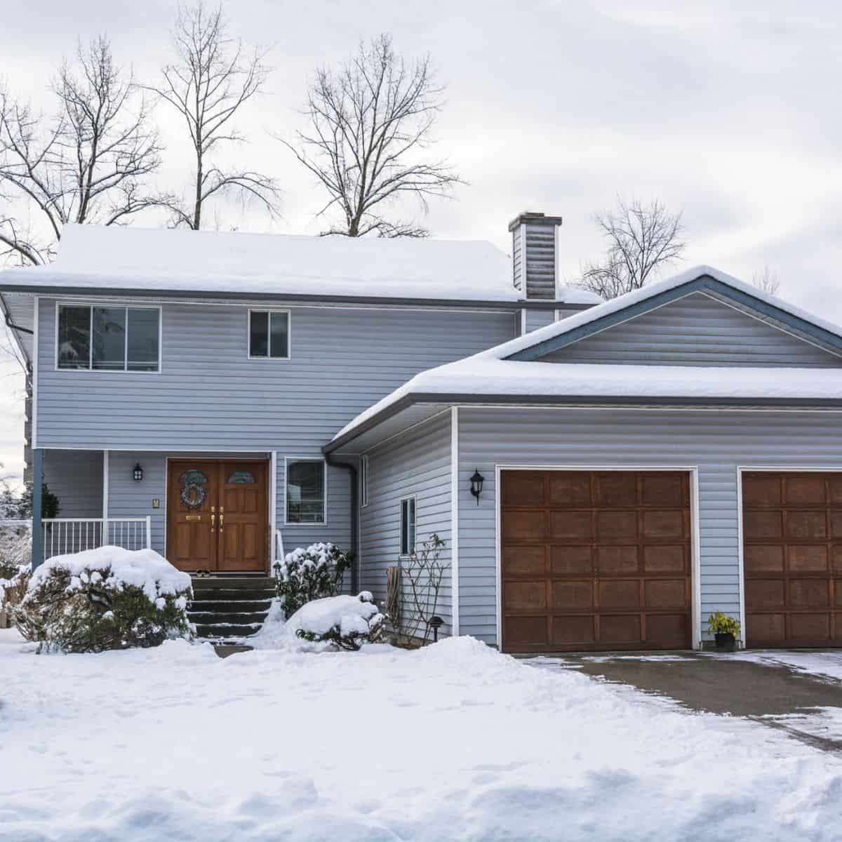 large home with snow