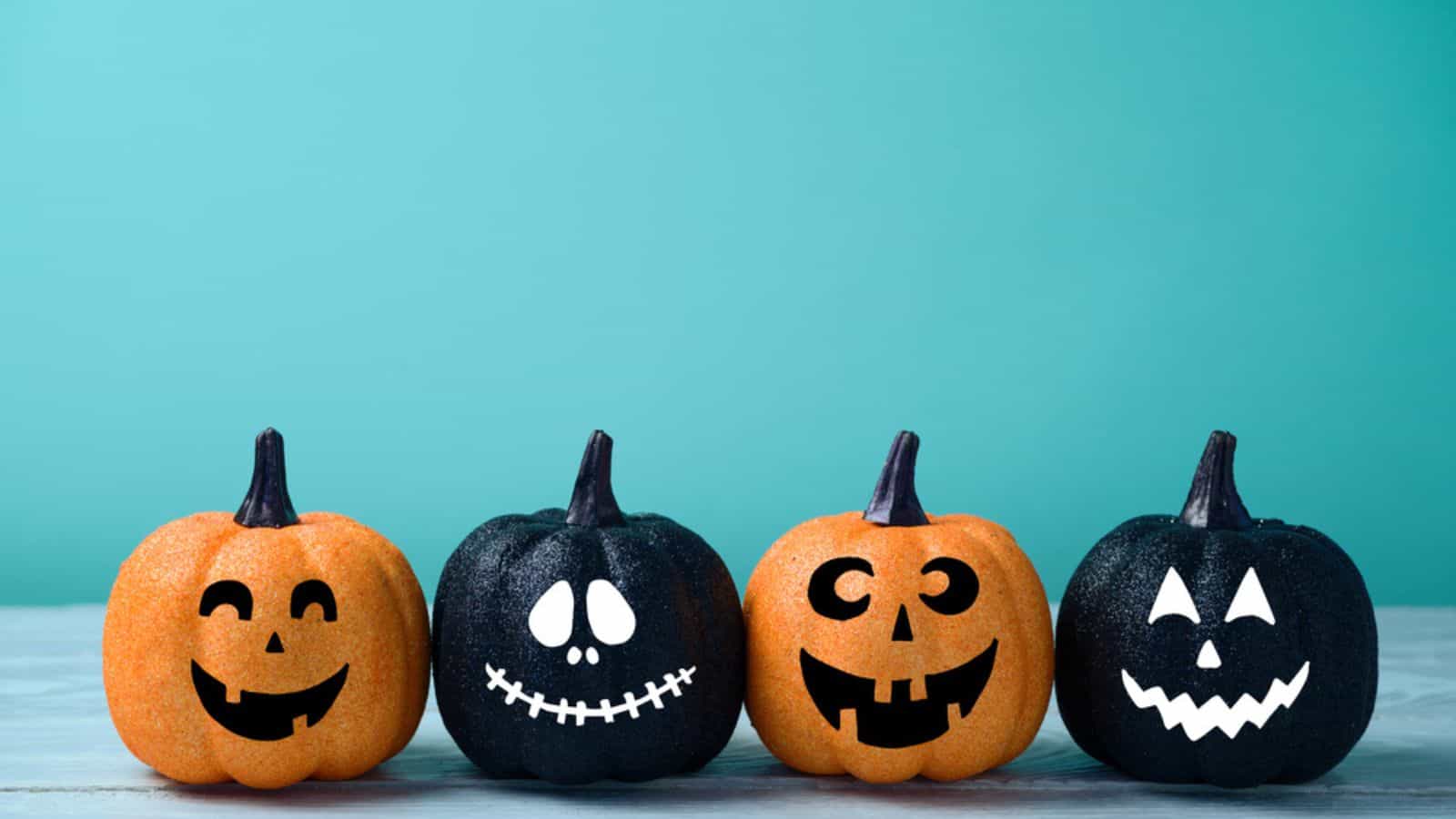 Jack-o-lanterns painted with faces