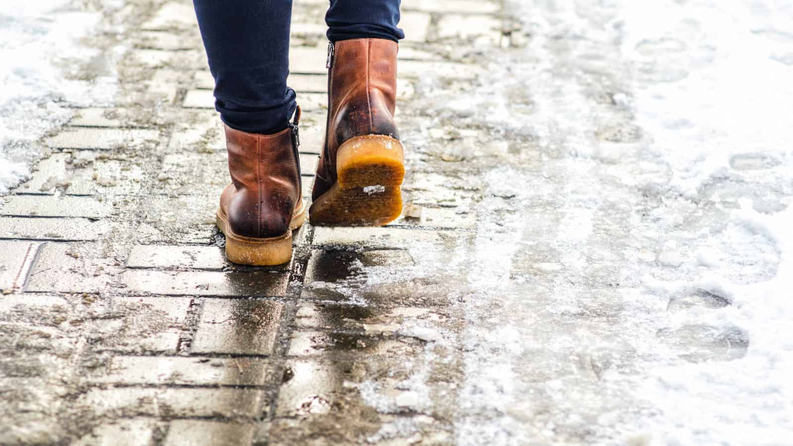 woman walking on icy sidewalk