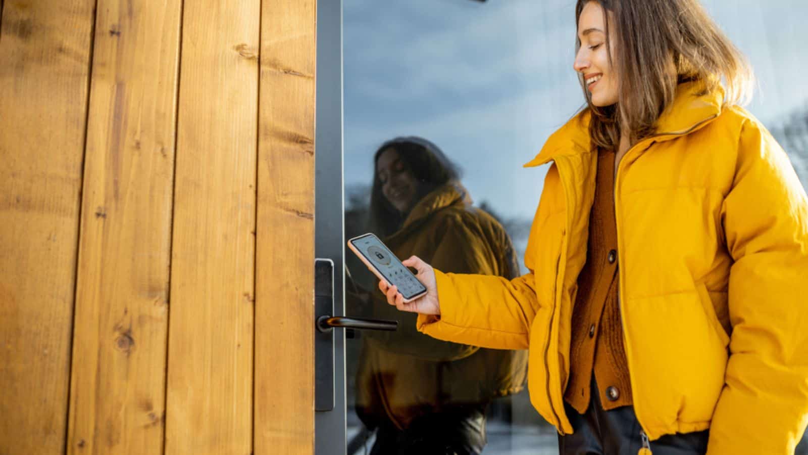 woman using a smart door lock