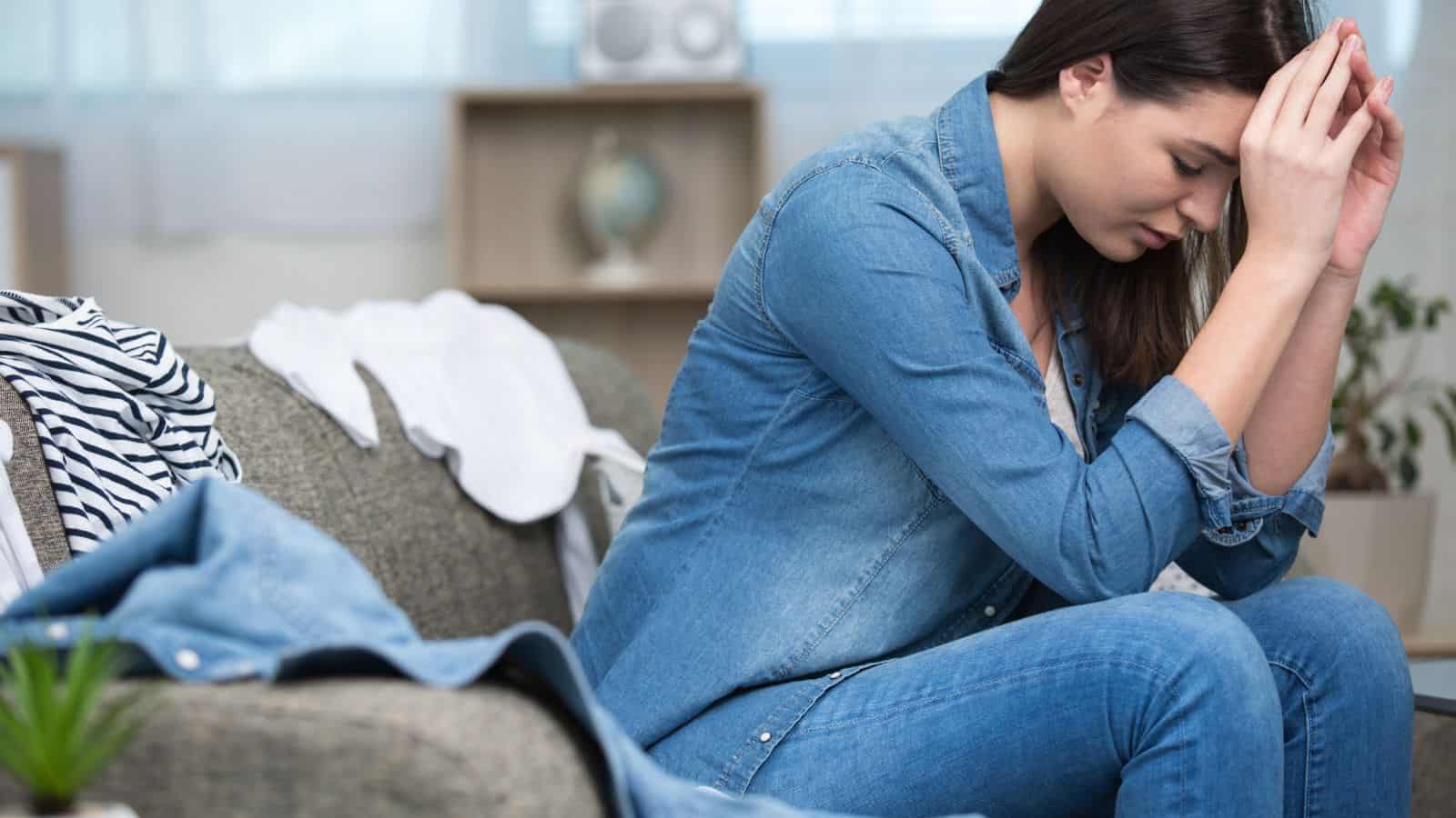 woman overwhelmed wth clutter