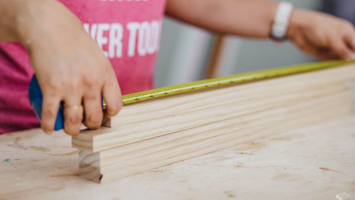 Anika measuring a board