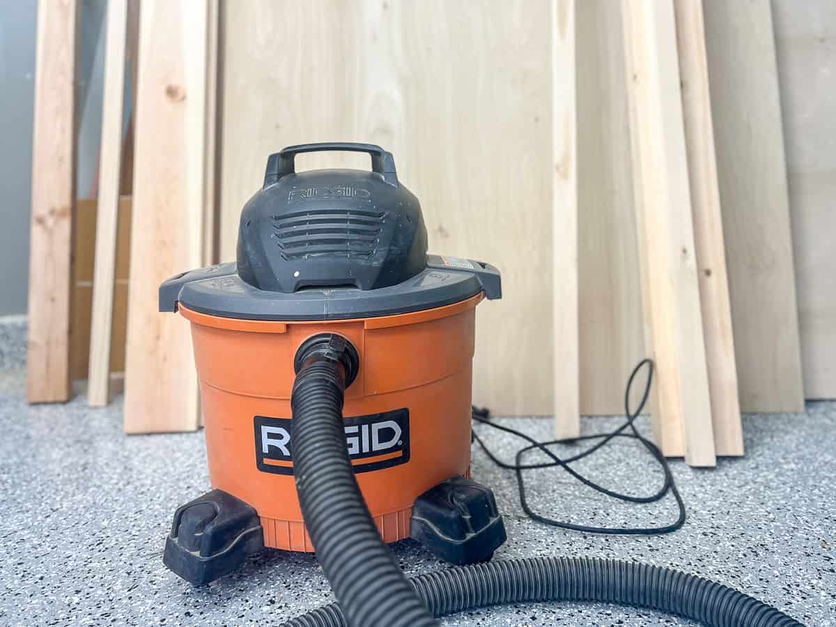 orange shop vac in woodworking workshop