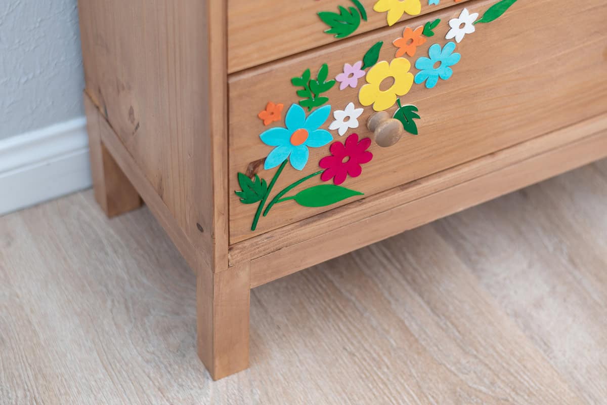 Closeup of the colorful Cricut Wood cutouts for the Ikea Rast makeover