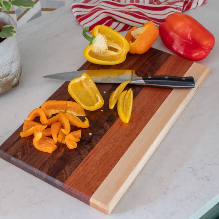 Make a beautiful DIY cutting board with walnut, mahogany, and maple in this easy, step-by-step guide for beginners.