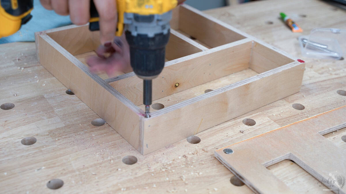 Adding a screw into the corners of the ziploc organizer