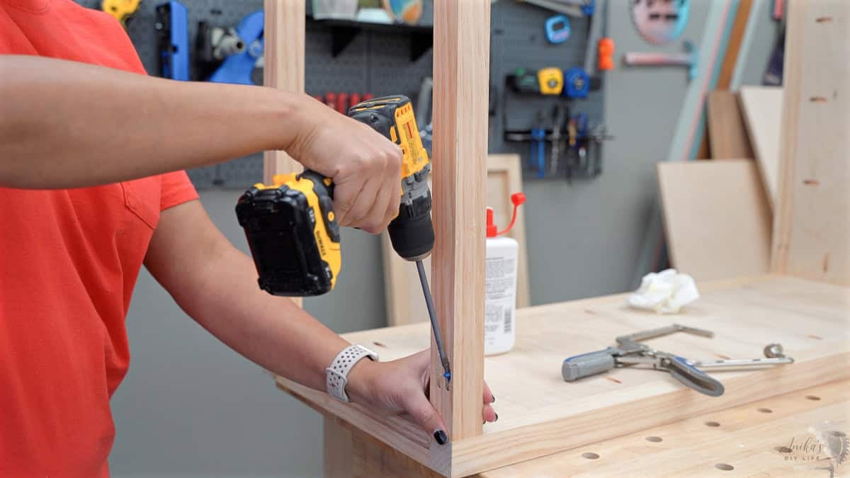 Driving pocket hole screws into a 2x2 board. 