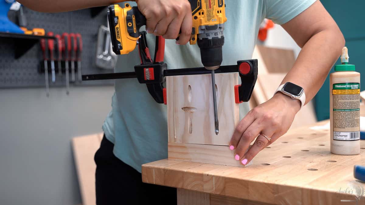 Attaching the side of the planter to the legs using pocket hole screws.