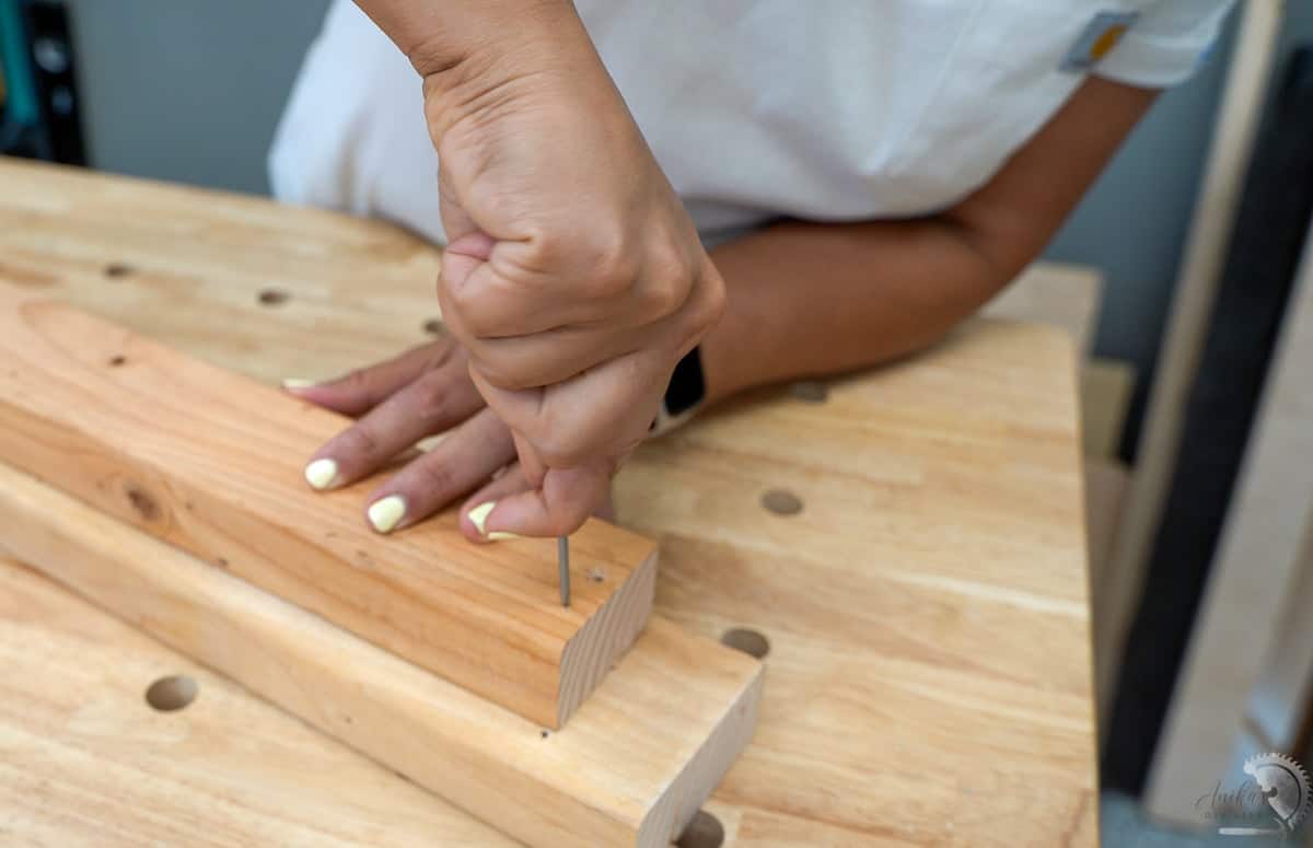 marking the hole location for predrilling with an awl.