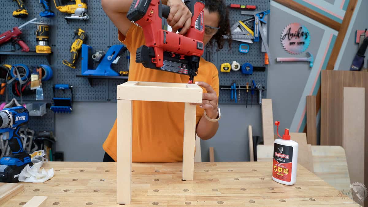 Attaching the long sides of the lantern using wood glue and a nail gun