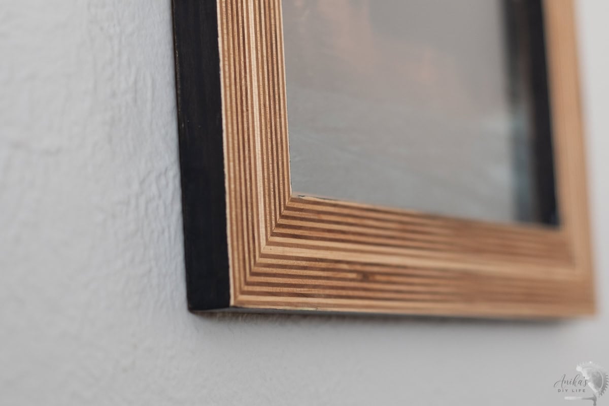 close up of the lower edge of the DIY plywood picture frame