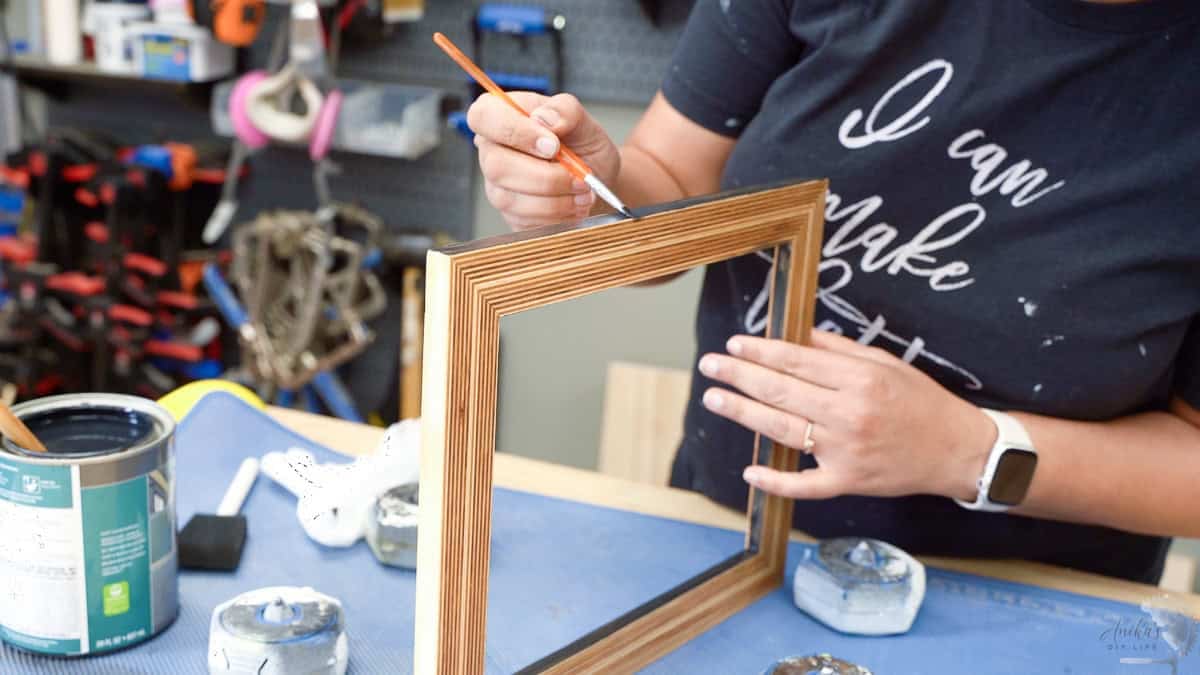 applying the finish to the picture frame