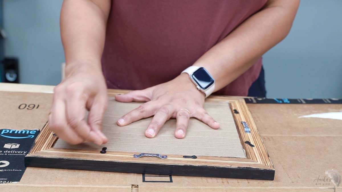 adding the picture frame hardware and assembling the picture inside
