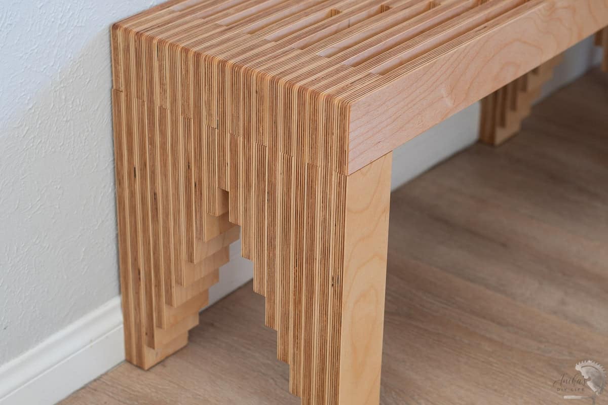 close up of the patterned plywod legs of the DIY plywood bench