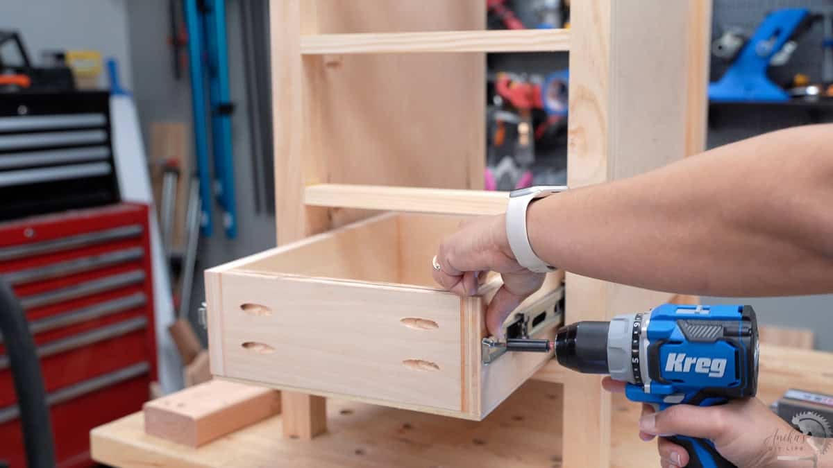 Attaching drawers in the drawer slides for the desk
