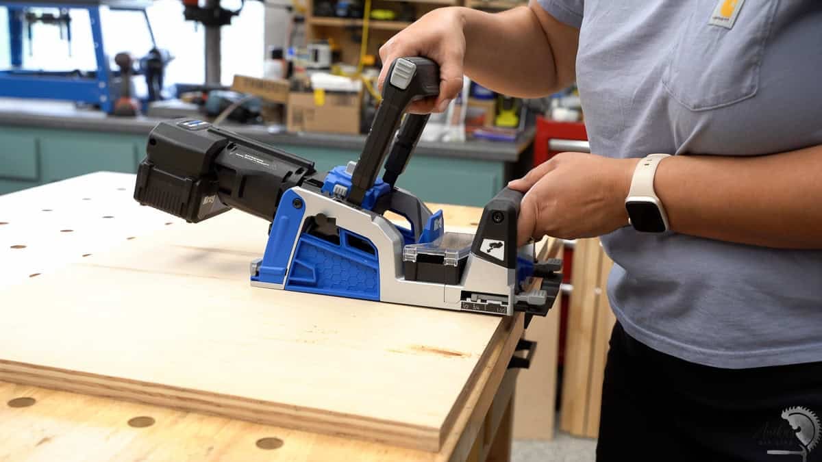 Anika using the Kreg Rebel to make pocket holes in the plywood.
