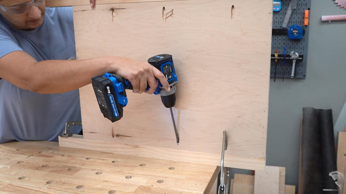 Attaching the side panels to the legs for the diy desk