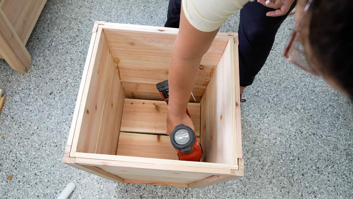 Attaching the inside supports and slats with a nailgun