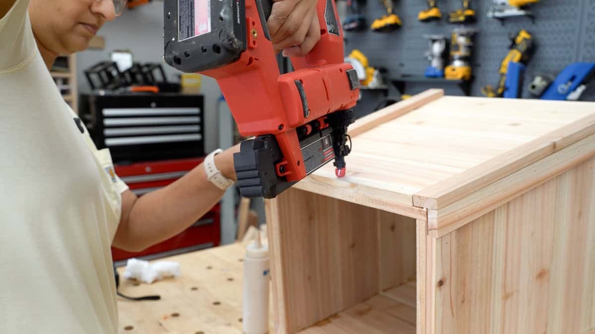 Attaching the horizontal trim pieces to the planter with a nail gun