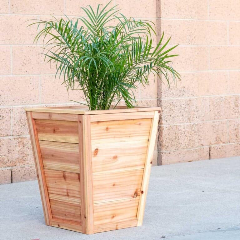 Learn how to build a high-end DIY Tapered Planter from cedar for under $30. This easy "stacked" design uses a simple 7-degree angle. No complex compound miters!
